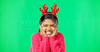 Buy stock photo Portrait, Christmas horns and girl excited, green screen and happiness on studio background. Face, young person and female child with smile, festive and surprise with joy and cheerful on backdrop