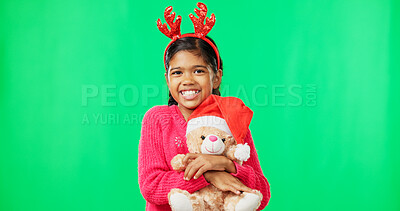 Buy stock photo Child, Christmas and bear on green screen as portrait with smile for celebration, toys as mockup. Kid, teddy and hugging gift or surprise from santa, present or festive season on studio background