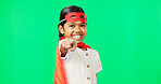 Superhero, point and face of child on green screen for fantasy, cosplay costume and comic character. Choose gesture, hero mockup and portrait of girl in studio for freedom, fight crime and games
