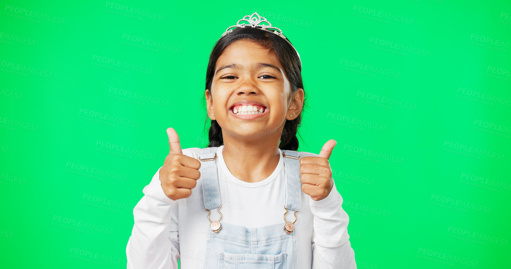 Buy stock photo Portrait, children and thumbs up with a girl on a green screen background in studio wearing a princess tiara. Kids, thank you and emoji with an adorable little girl child saying yes in agreement