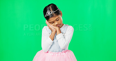 Sleeping, tired gesture and child on green screen with crown, princess costume and tutu in studio. Sadness, sleepy mockup and isolated young girl with fatigued, dreaming and nap expression for rest