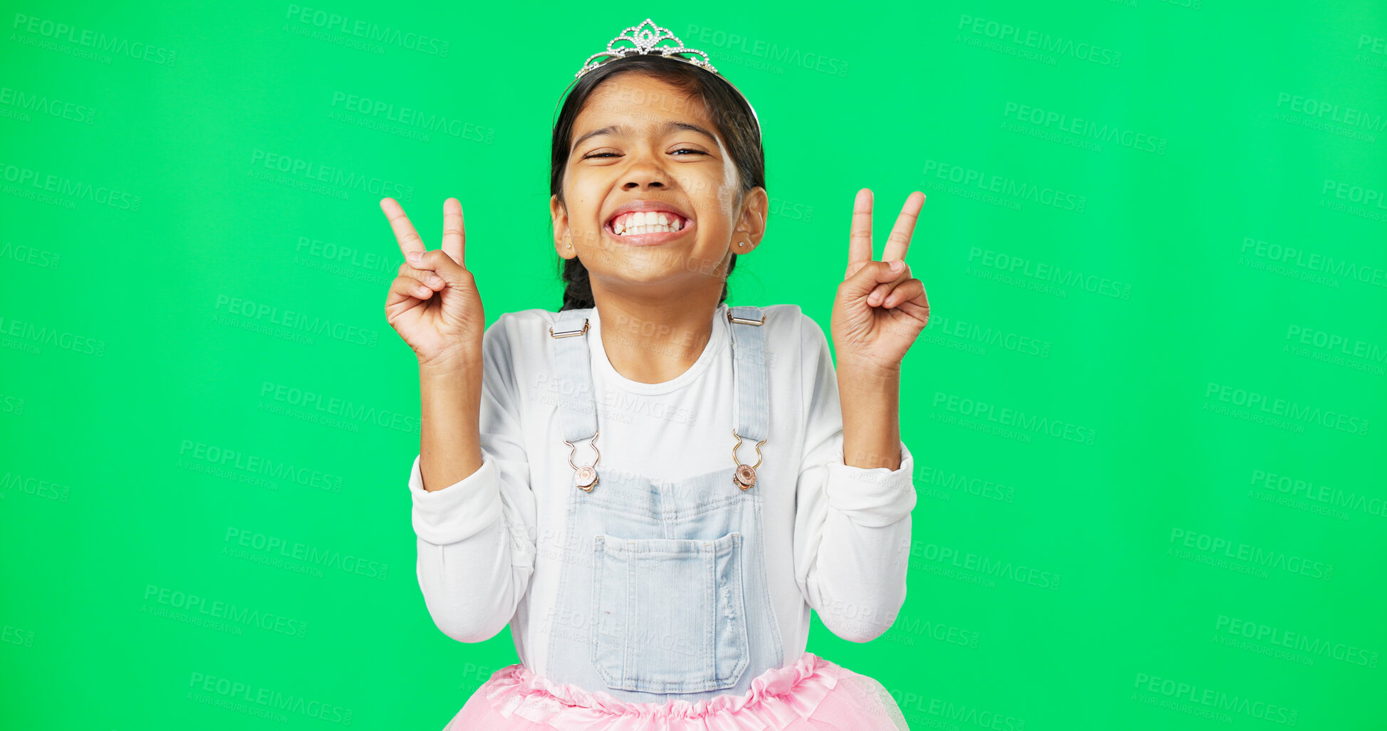 Buy stock photo Peace, portrait and hand gesture with a girl on a green screen background in studio feeling silly or carefree. Fun, dance and emoji with an adorable little female child looking goofy or playful