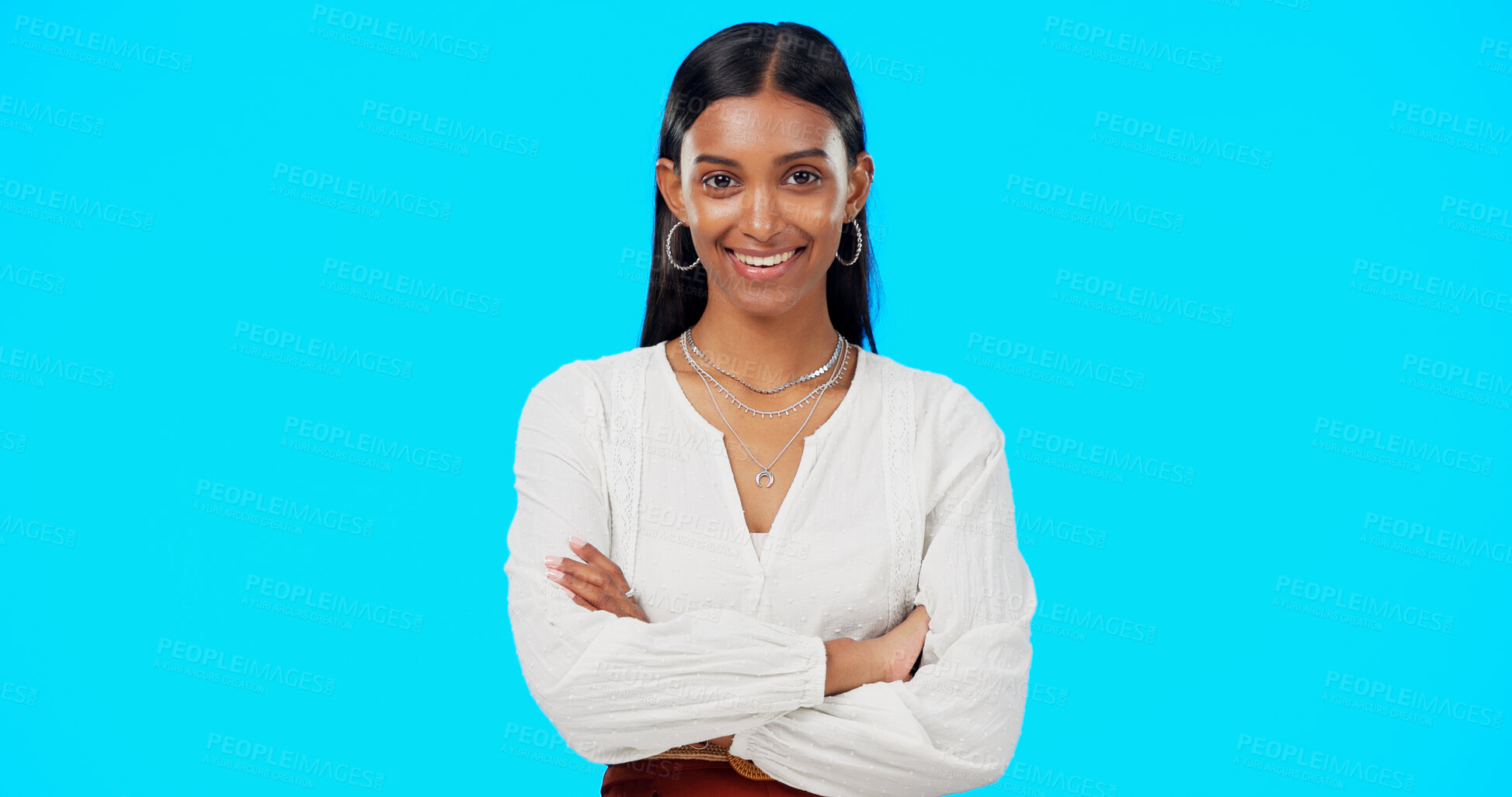 Buy stock photo Crossed arms, business and portrait of Indian woman in studio for career, job and work opportunity. Professional, confident and face of isolated person on blue background with pride, ambition and joy