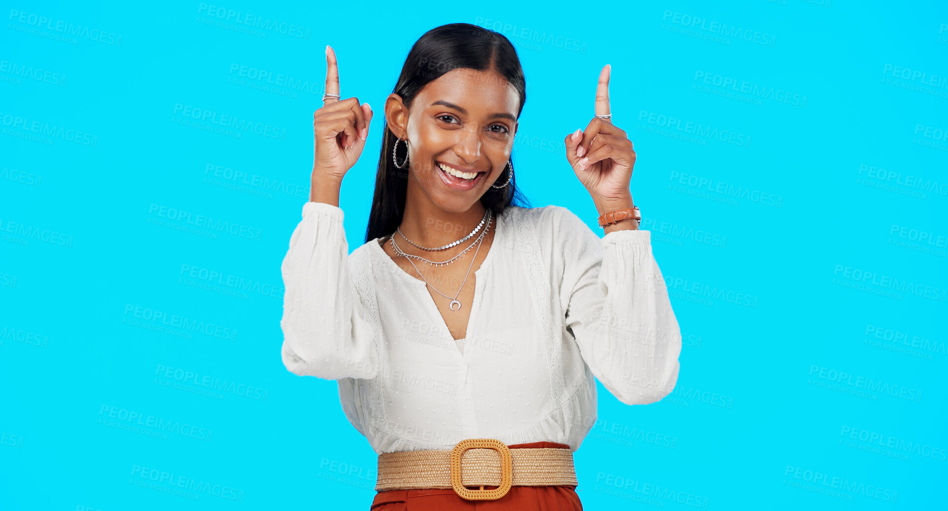 Buy stock photo Studio portrait, happy and woman point at advertising news, commercial promotion or brand logo design. Retail information, sales discount offer and model notification announcement on blue background