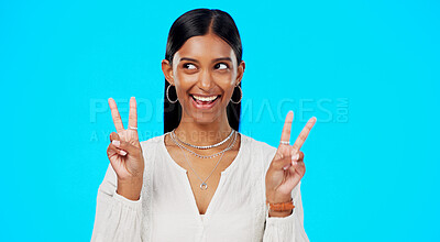 Buy stock photo Peace sign, business and face of Indian woman in studio happy for career, job and work opportunity. Professional, confidence and isolated person on blue background with fun, ambition and emoji hand