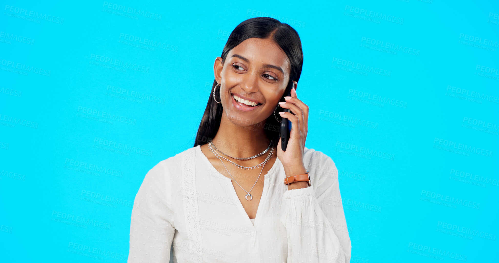 Buy stock photo Happy business woman, phone call and discussion for communication against a blue studio background. Female person or employee smile and talking on mobile smartphone for conversation or networking