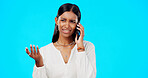 Phone call, business woman and studio with a Indian female talking, networking and speaking. Mobile communication, online discussion and tech network of a young person with isolated blue background