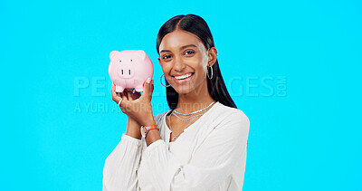 Buy stock photo Portrait, piggy bank and woman in studio with smile, savings and budget for financial investment insurance. Planning, banking and happy girl with money box for profit, tips or cash on blue background
