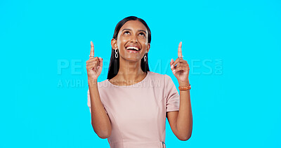 Buy stock photo Advertising studio smile, woman and pointing up at ads commercial, promotion or excited for notification. Sales info, discount and Indian ambassador presentation, choice or deal on blue background