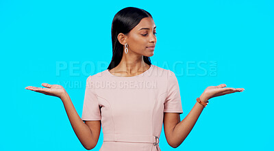 Buy stock photo Comparison, thinking and scale hands of woman palm with choice in a studio with promo question. Decision, doubt and female person with option, balance and confused with blue background mockup space