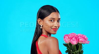 Buy stock photo Woman, valentines day and floral bouquet in studio portrait with beauty, gift and romance by blue background. Girl, present or flowers with roses, birthday and celebration on date, event or party