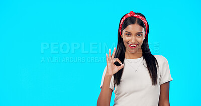 Buy stock photo Happy portrait, studio woman and okay sign for advertising news, commercial promotion and brand agreement, vote or opinion. Mockup space, emoji ok icon and Indian model feedback on blue background