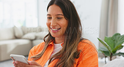 Woman, phone and laughing for funny joke, meme or social media post relaxing on living room sofa at home. Happy female chatting, texting and laugh on smartphone for fun online communication on couch