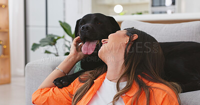 Happy woman relax with her dog at home for mental health, wellness or emotional support, love and care. Young person sitting on living room floor and pet, animal or Labrador retriever kiss and stroke