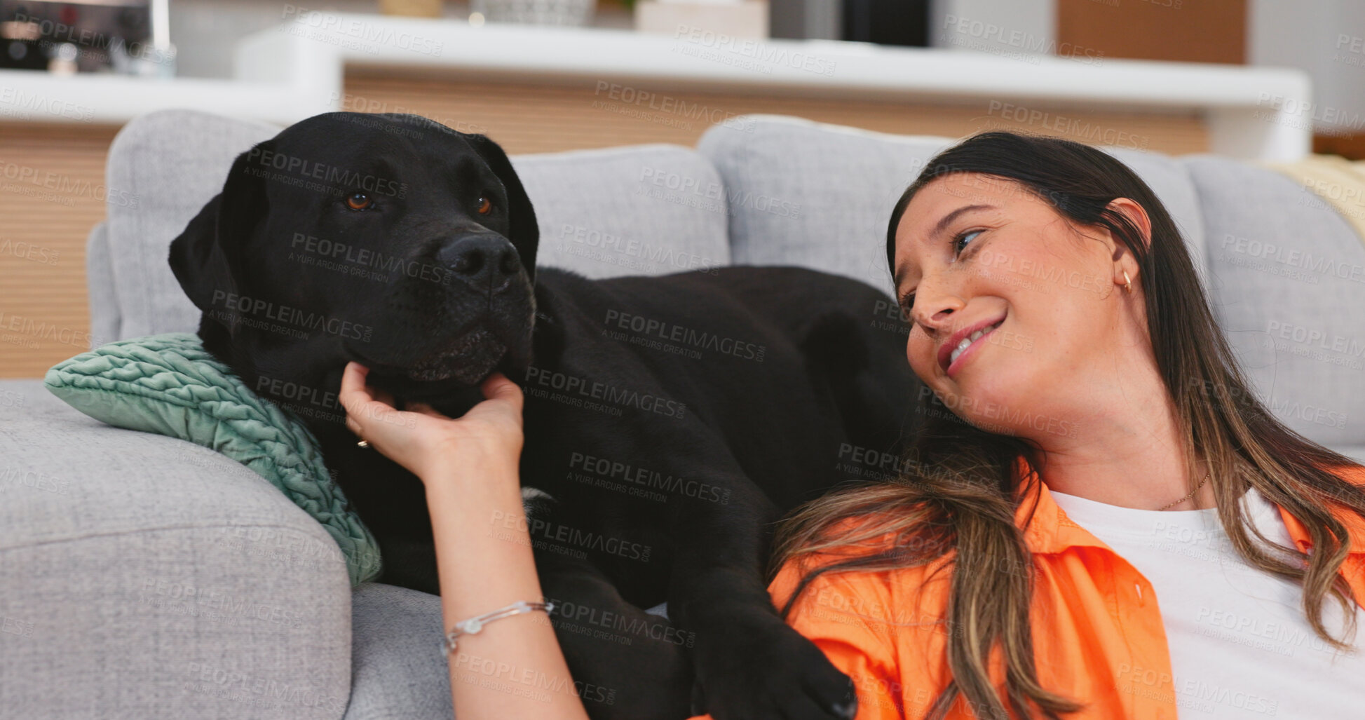 Buy stock photo Sofa, dog and woman care for pet in a living room with love for puppy in a house or apartment on a couch with animal. Happy, relax and person enjoy freedom with happiness and bonding in lounge