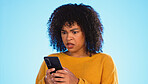 Angry, smartphone and black woman shouting, stress and social media with girl against a blue studio background. African American female, moody lady and cellphone with connection, upset and screaming