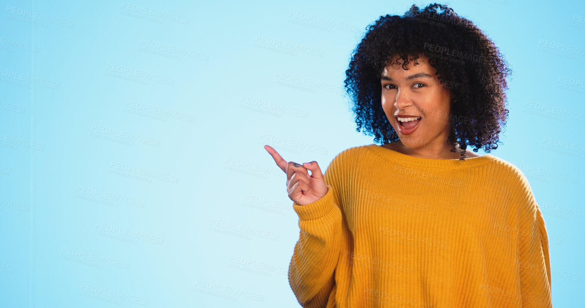 Buy stock photo Woman, pointing at mockup for advertising or promotion in studio, portrait with information and news on blue background. Announcement, marketing and about us with launch presentation and platform