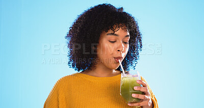 Green juice, black woman drinking and healthy smoothie of a person with weight loss drink. Studio, blue background and female with vegetable, nutrition and detox fruit shake for health and wellness