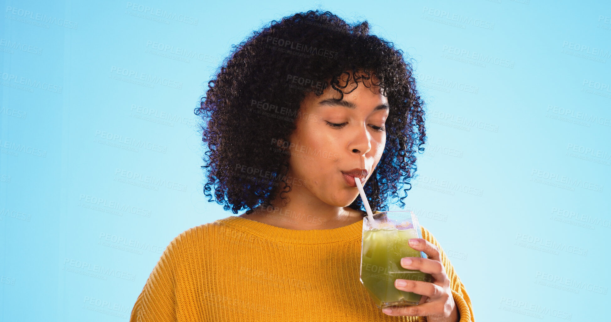 Buy stock photo Woman, drinking green juice and health to lose weight and nutrition isolated on blue background. Detox, diet and wellness, healthy smoothie or shake, glass in hand with drink and hydration in studio