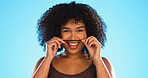 Hair, moustache and a playful black woman joking in studio on a blue background for fun or games. Portrait, face or haircare and a silly young female comic playing with her hairstyle in comedy