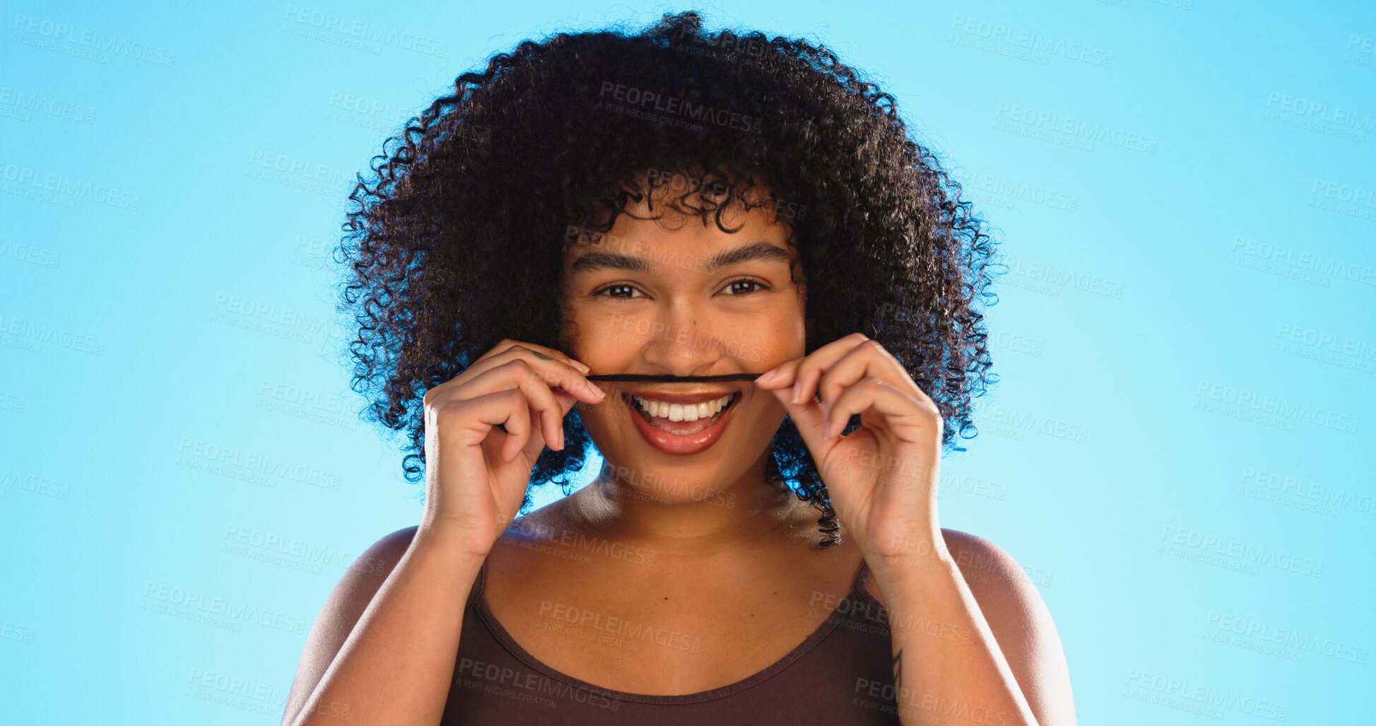 Buy stock photo Hair, moustache and portrait of a woman joking in studio on a blue background for fun or games. Happy, face or smile and a silly african female ,model playing with her hairstyle for comedy or funny