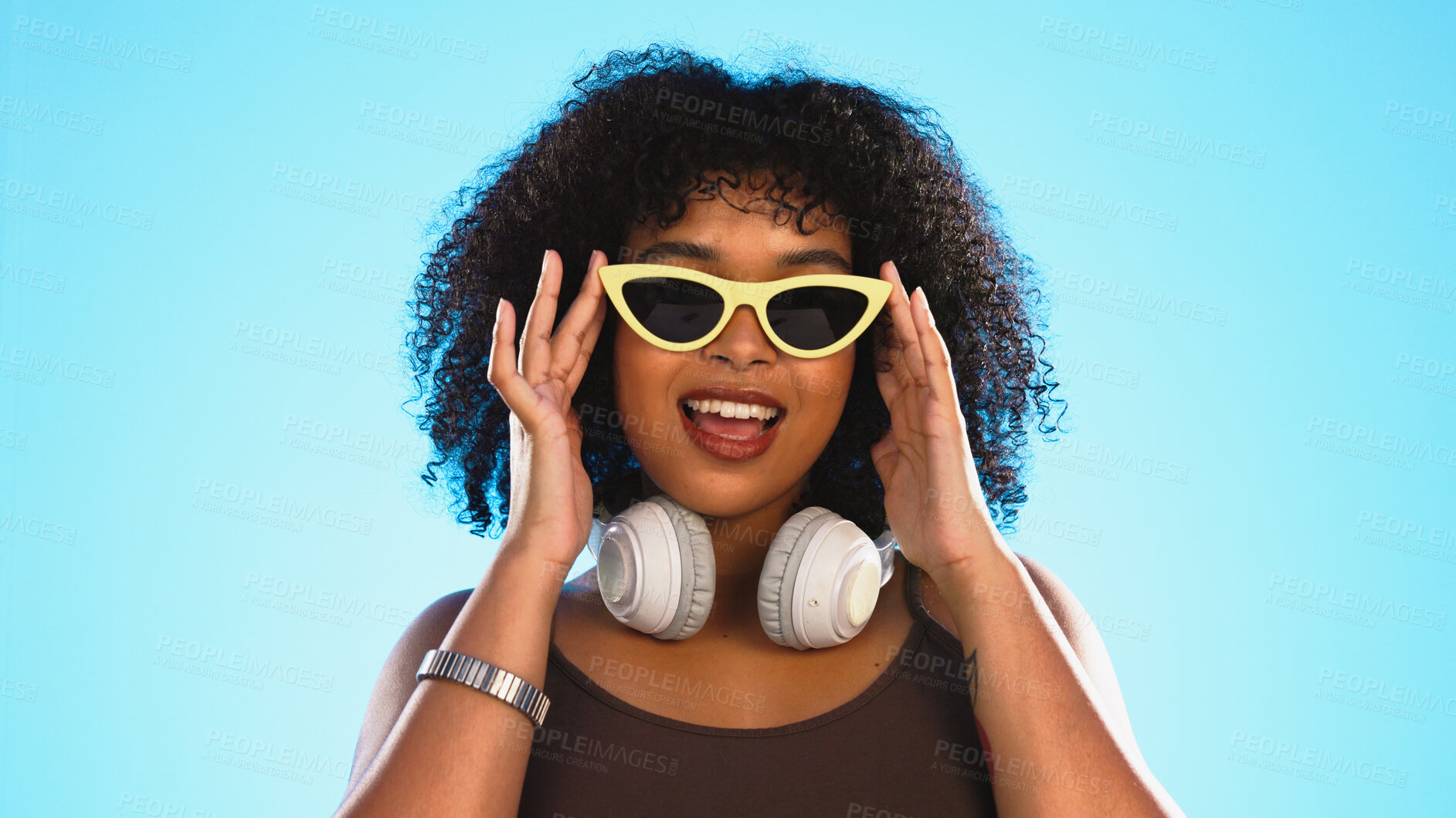 Buy stock photo Fashion, black woman and portrait with sunglasses for creative style, summer and retro lifestyle in studio on blue background. Face, beauty and african person with headphones, confidence and smile