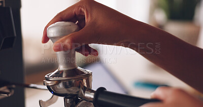 Hands, barista and coffee machine with an employee working behind a kitchen counter in a cafe for service. Waiter, cafeteria and caffeine with a person making a drink at work in a restaurant