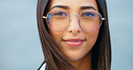 Fashionable student watching, gazing with trendy optometry vision glasses. Detail closeup portrait of funky, cool and friendly woman looking forward in city and wearing optician prescription eyewear