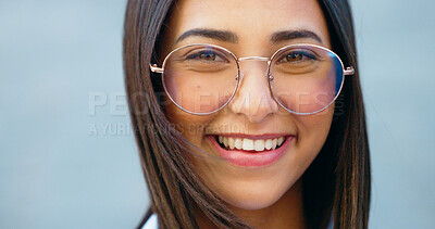 Fashionable student watching, gazing with trendy optometry vision glasses. Detail closeup portrait of funky, cool and friendly woman looking forward in city and wearing optician prescription eyewear