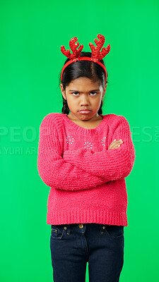Buy stock photo Portrait, christmas and unhappy girl, green screen and standing with arms crossed, angry or sad. Child, frustrated  and miserable with antlers headband, moody and annoyed for festive, tantrum, or mad
