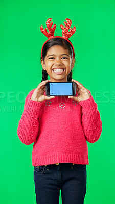 Buy stock photo Christmas phone, green screen portrait and happy child for holiday event, online mockup space or festive announcement. Advertising kid, mobile cellphone news or Xmas presentation on studio background