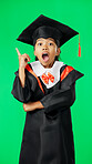 Graduation, surprise and child point on green screen for graduate, academy ceremony and award. Primary school, education and portrait of shocked girl with knowledge, achievement and success in studio