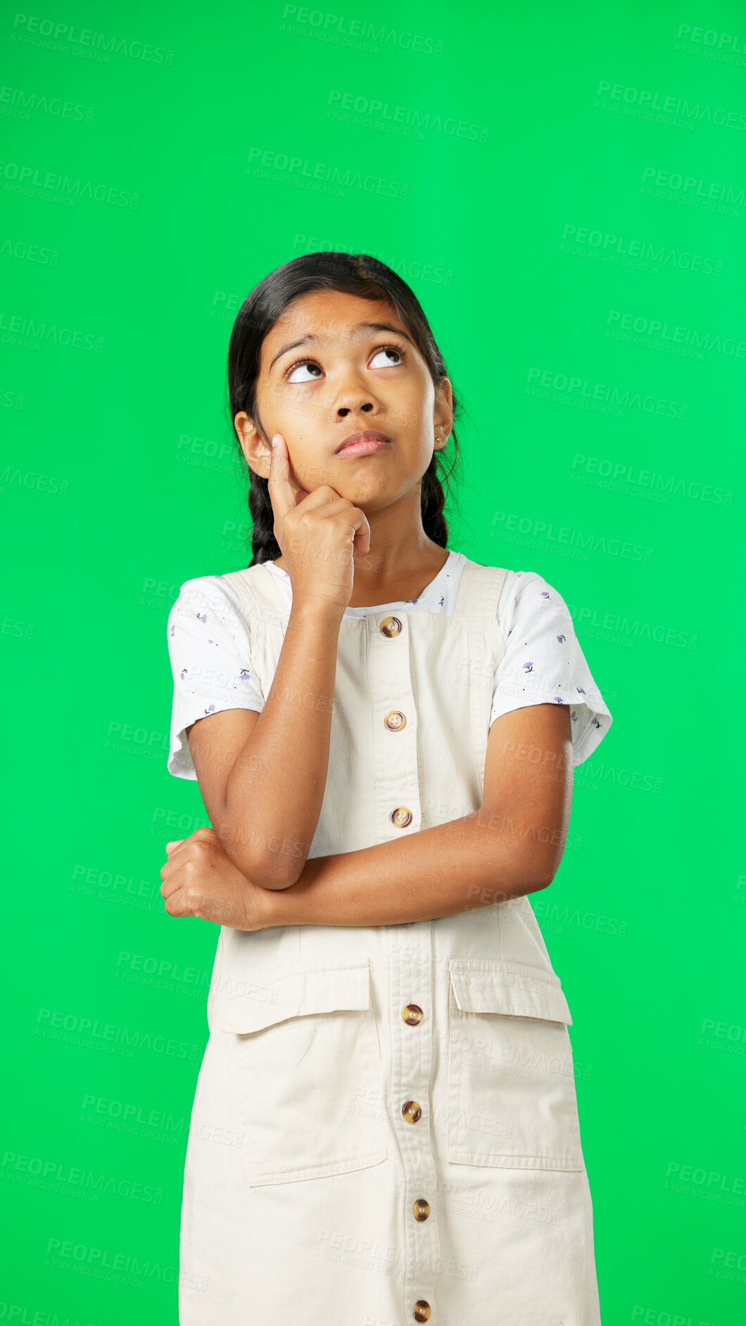 Buy stock photo Thinking, idea and child looking up on green screen background with mockup space for choice. Question, wondering and young girl in chromakey studio for brainstorming planning, option and decision