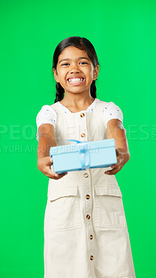 Girl child, box and gift by green screen studio in with smile, happiness or giving mockup for kindness. Kid, vertical portrait and present package on holiday, birthday party or happy childhood memory
