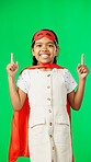 Superhero, point and face of child on green screen for fantasy, cosplay costume and comic character. Advertising, copy space and portrait of kid in studio for freedom, fight crime and games mockup