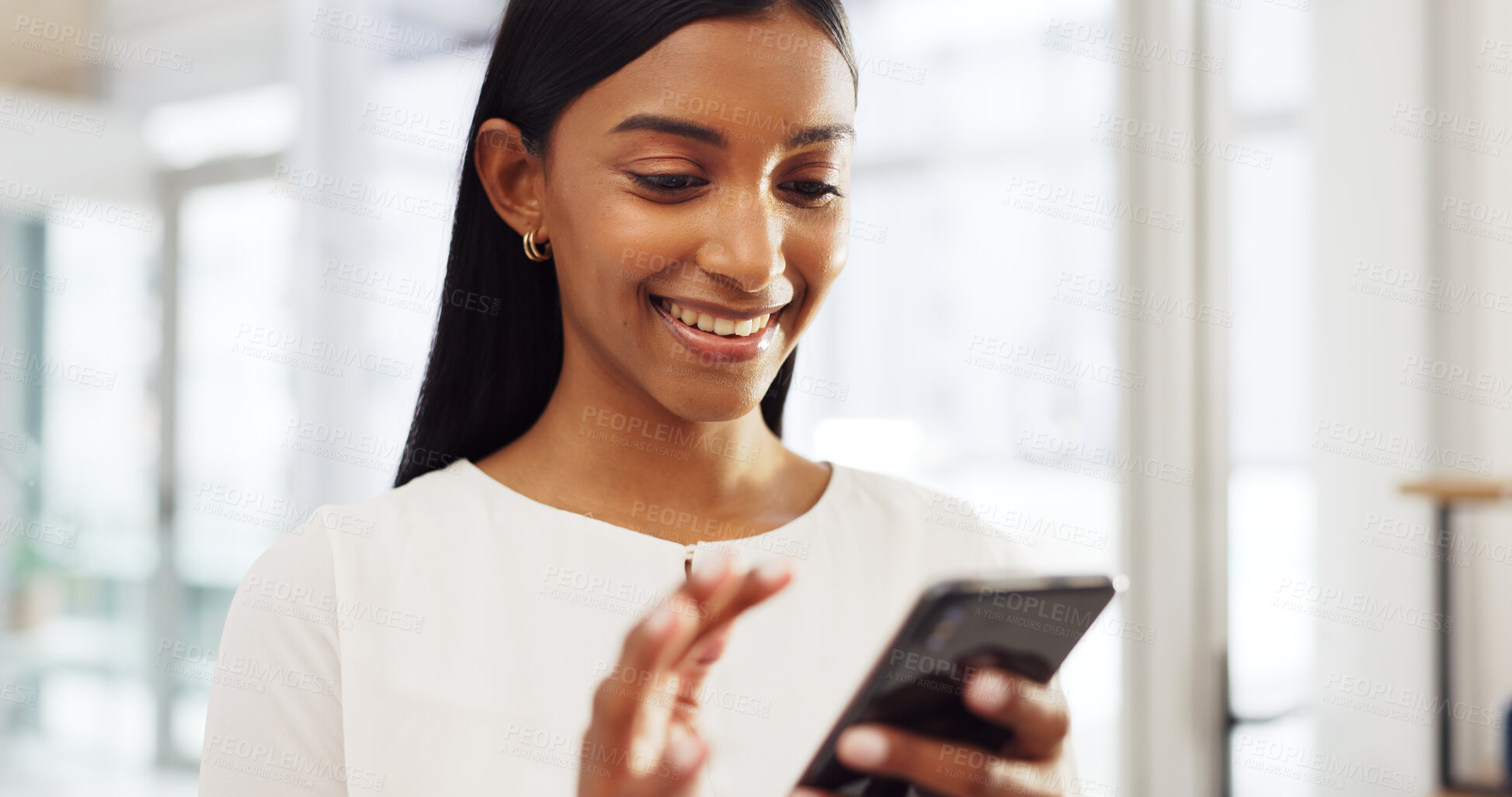 Buy stock photo Happy woman in office with smartphone, scroll on website post or email, networking and connectivity on mobile app. Online communication, social media or chat, girl with smile and phone reading meme.