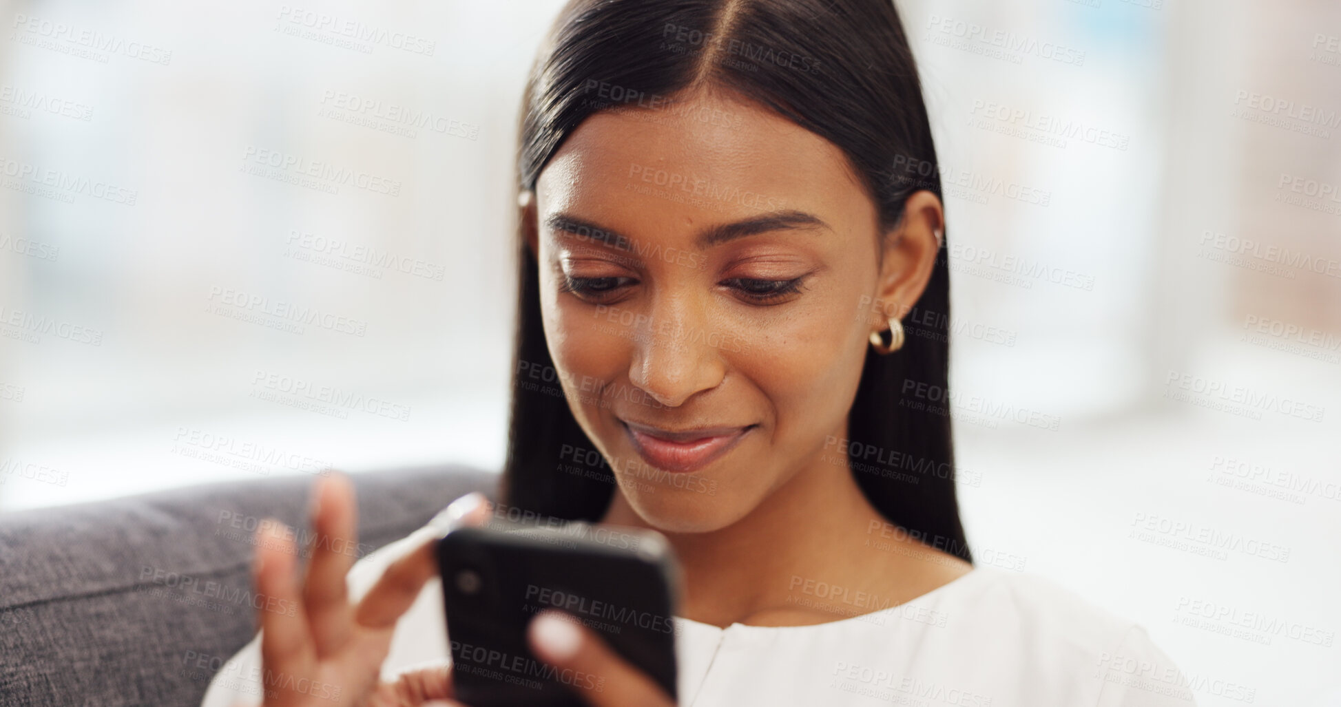 Buy stock photo Social media, relax and Indian woman on sofa with phone  for online website, internet and texting at home. Communication, connection and happy person in living room on smartphone for mobile app