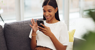 Happy girl with phone relax on sofa or living room couch while laughing or smile at a meme. Young girl with mobile at home, house or apartment doing a internet or web search for funny comedy videos