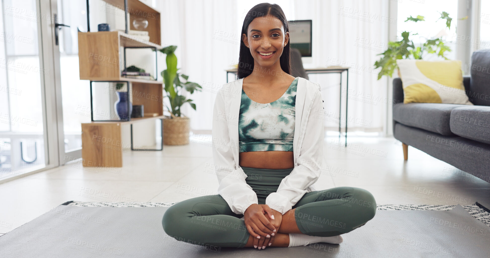Buy stock photo Yoga, fitness and happy with a woman portrait with a smile in her home for health and wellness. Healthy, zen and meditation with a young female person sitting on a gym mat on the living room floor