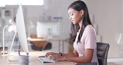 Portrait of a female psychologist working online and making appointment notes in her calendar. One young professional therapist planning, checking and filing out medical information on her computer