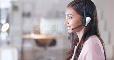 Call center or customer support agent talking to a client using headphones while sitting and working inside. Remote worker offering great service, advice and explaining a product or insurance plan
