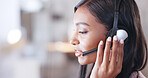 Call center agent helping client in a phone call giving great customer service. Customer support employee consulting clients online using headset. Professional friendly woman working at her desk