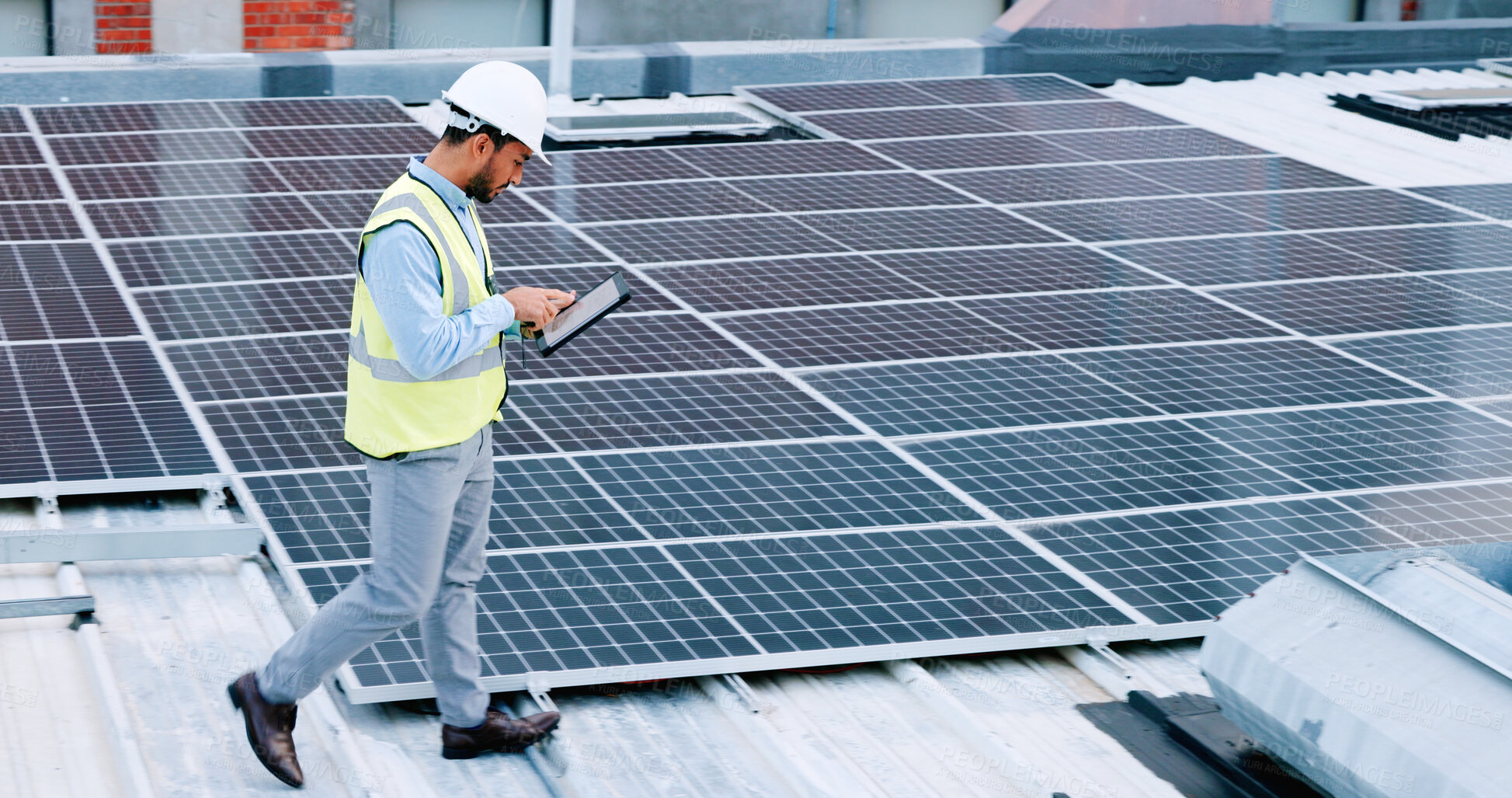 Buy stock photo Engineer, contractor tablet and solar panel with a man on roof with sustainability project. Engineering technician, clean energy and eco friendly work with monitoring and maintenance for electricity 