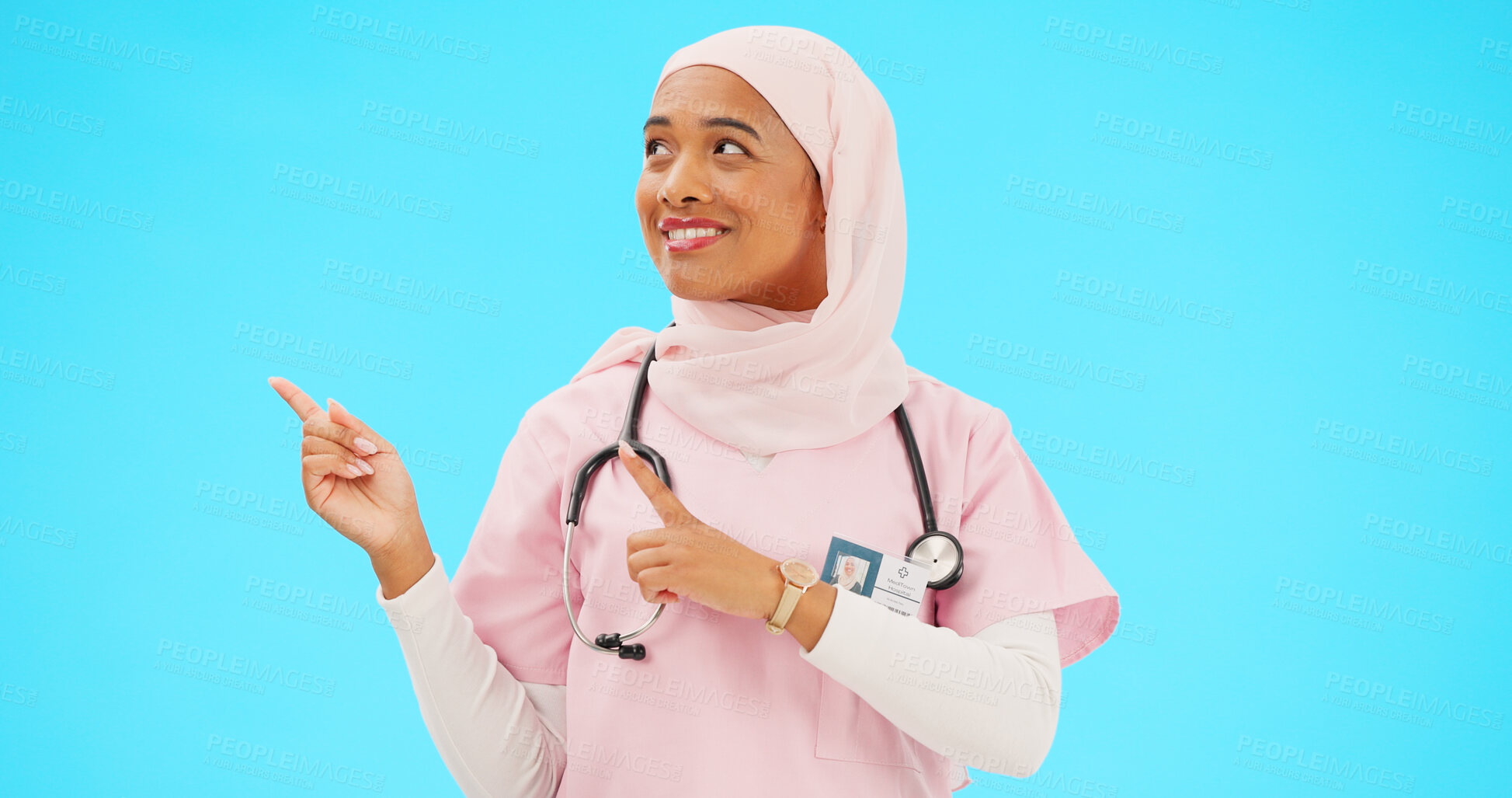 Buy stock photo Muslim nurse, hands or pointing to space on studio background for healthcare information, offer or medical deal. Doctor, professional or Islamic woman showing mockup, promotion and medicine choice