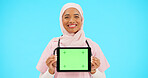 Woman, doctor and tablet green screen in studio for website information or medical record app. Muslim female or professional nurse in hijab and mobile device for online healthcare on blue background