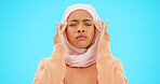 Muslim woman, headache and pain in studio for depression, stress and burnout. Islamic female with hands on head for a massage or mental health in a hijab while depressed, sick and fatigue or anxiety