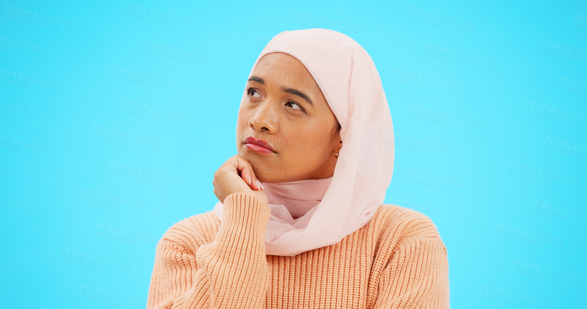 Buy stock photo Muslim woman, thinking and idea for mockup, advertising and thought. Serious islamic female, hijab and emoji for doubt, confusion and options for choices, isolated and on a blue studio background