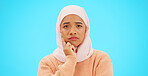 Muslim woman, thinking and idea with hand on face for mockup, advertising or thought. Serious islamic female with hijab and emoji for doubt, sad and to think about option on a studio blue background