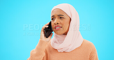 Buy stock photo Islamic woman, phone call and sad in studio with thinking, chat and contact by blue background. Muslim person, smartphone and listening for bad news, conversation and ideas for talk on mobile network