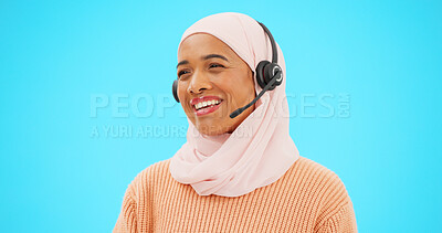 Buy stock photo Islamic woman, call center and talk in studio, smile or voip mic for customer service by blue background. Muslim crm, tech support agent and thinking with smile for advice, solution and help desk job